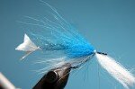 Now fold the access blue fox backwards and spread it around the top section of the hook. This makes the fly more streamlined and also gives a better fit on the head once it is slided on.