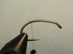 Step 1. Wrap base layer of thread to above hook barb.