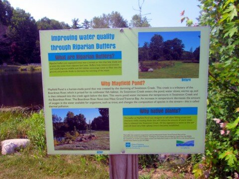 A sign explaining the functionality of Mayfield Pond.