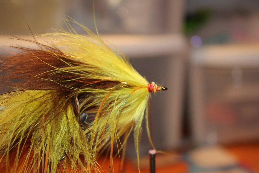 Palmer in a piece of yellow marabou and add legs.