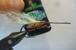 Put a drop of uv-resin at the base of the fibers and hit it with your uv light.That little drop may seem insignificant but it will help a lot with keeping the tail from fouling around the hook.